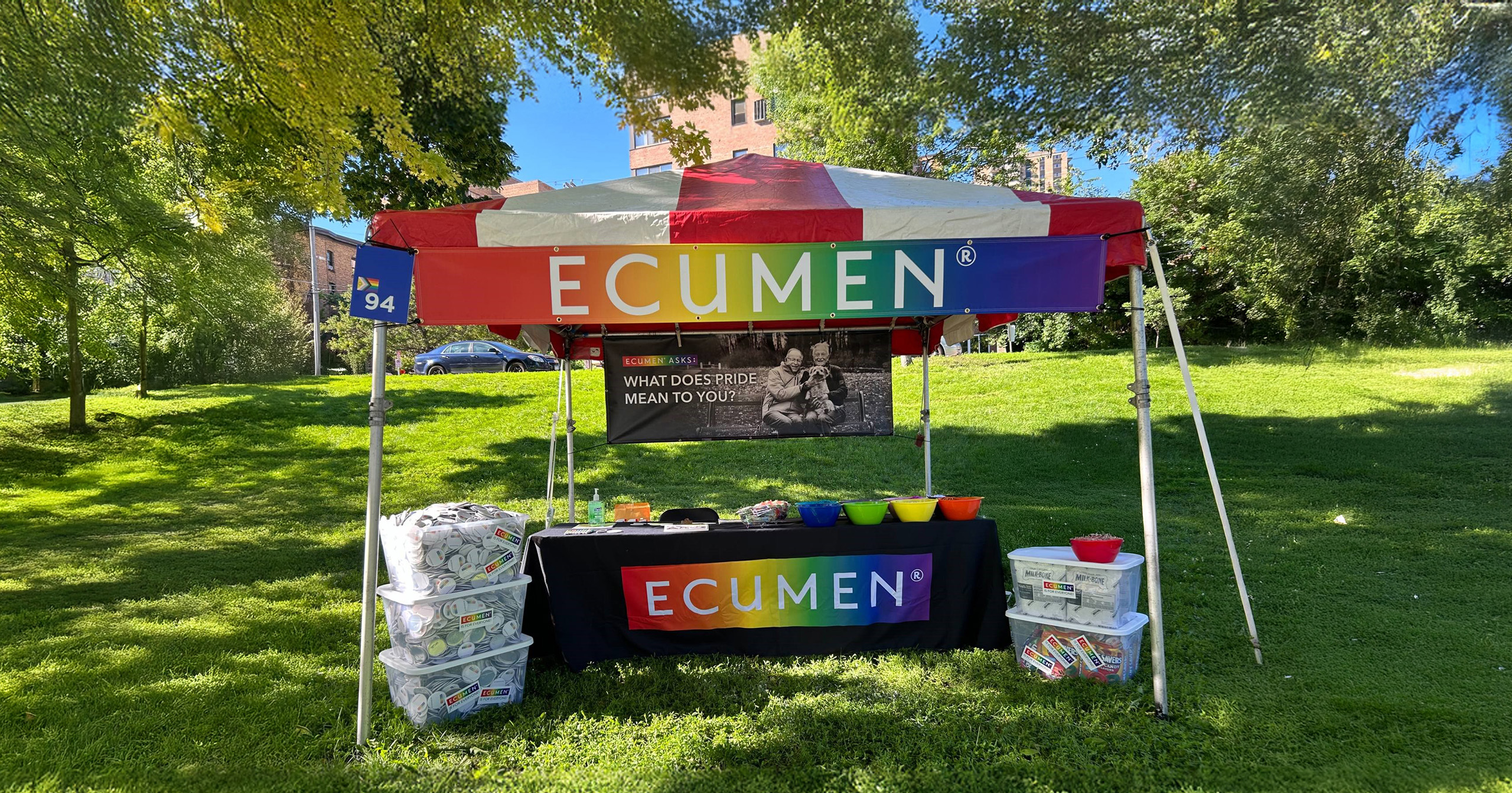 Ecumen's colorful Pride booth outside at the Twin Cities Pride Festival