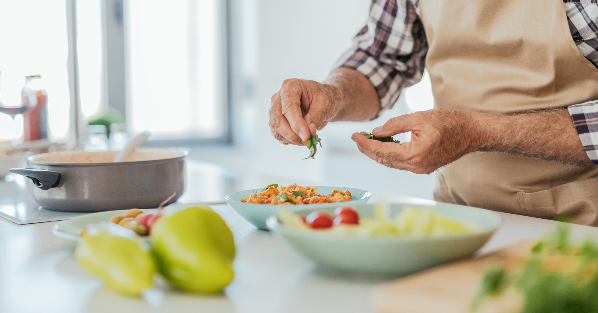 Fresh produce ingredients on a kitchen countertop during meal preperation.