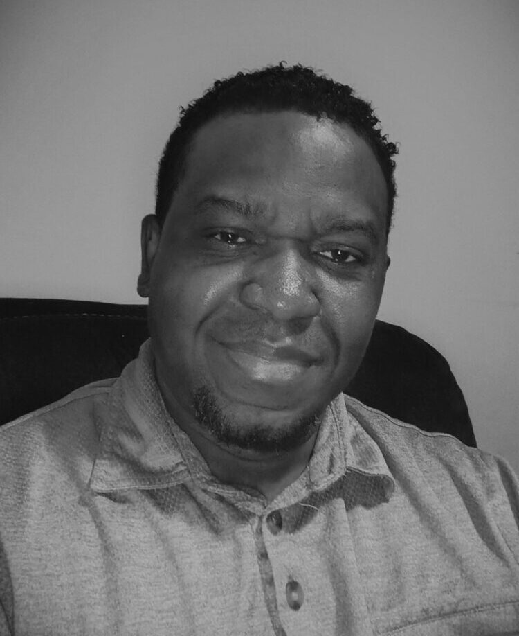 Professional black and white portrait of Itoro Asuquo