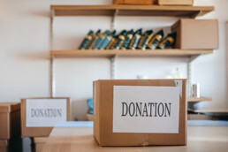 boxes of donations in a storage room