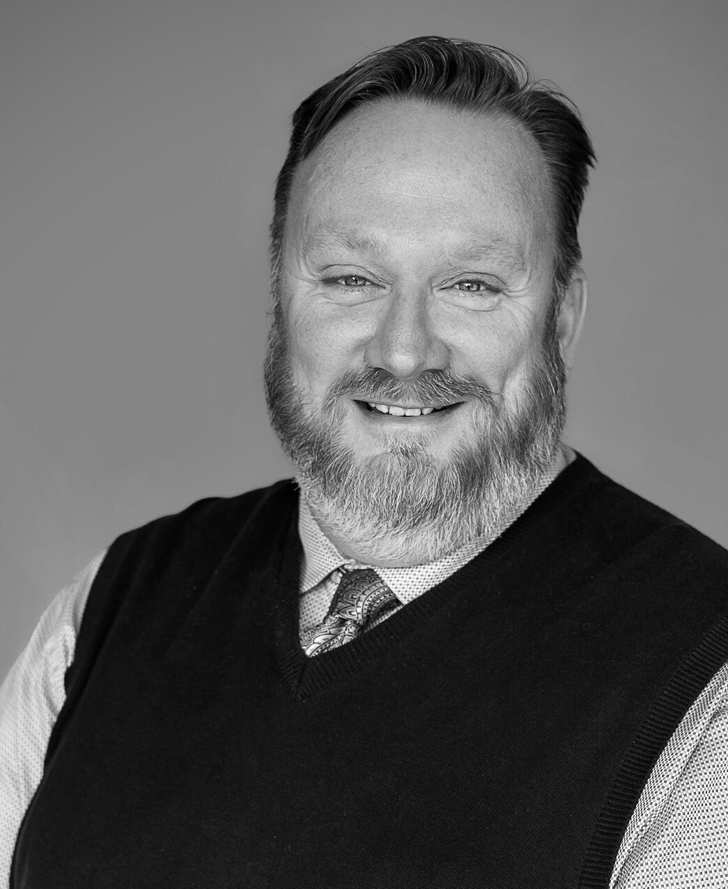 Black and white professional portrait of Craig Bennett