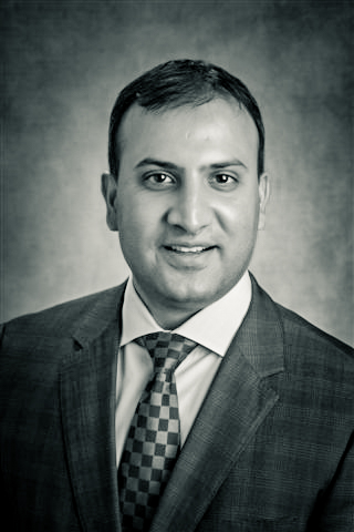 Professional black & white headshot of Dr. Cyrus Batheja, EdD, MBA, RN, FAAN