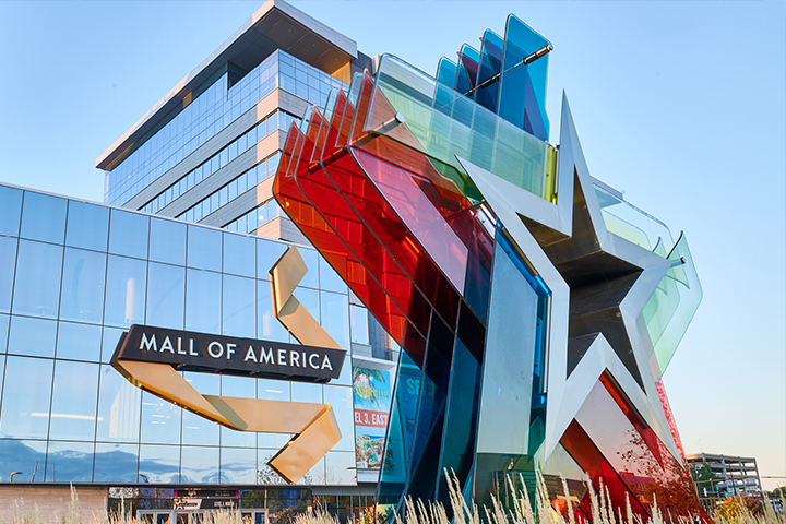 A large colorful star-shaped monument sign outside Mall of America.