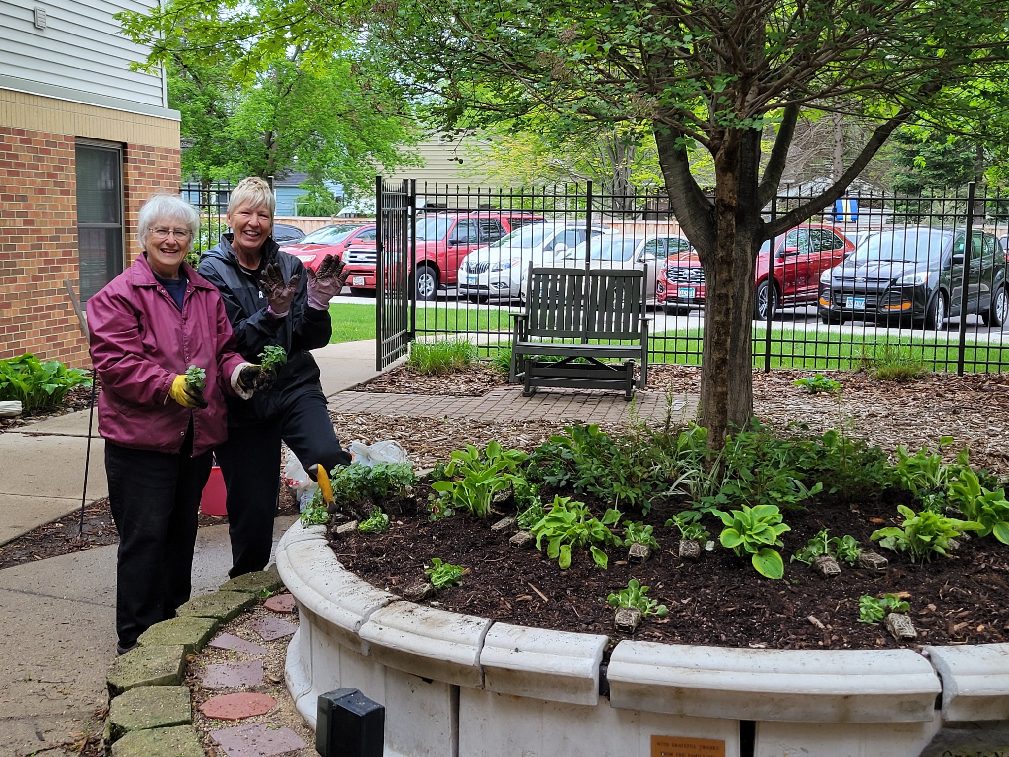 2 Volunteers helping with spring planting