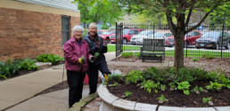 2 Volunteers helping with spring planting