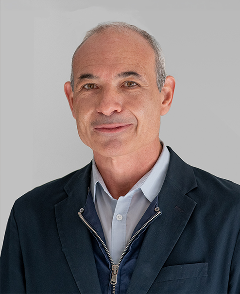 Professional portrait of Tommaso Cammarano, wearing a button down shirt, zipper vest and sport coat...