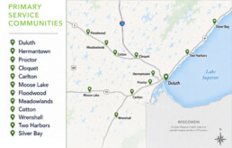 A map showing primary service communities in Minnesota near Lake Superior, marked with green pins for cities including Duluth, Hermantown, Proctor, Cloquet, Carlton, Moose Lake, Floodwood, Meadowlands, Cotton, Wrenshall, Two Harbors, and Silver Bay.