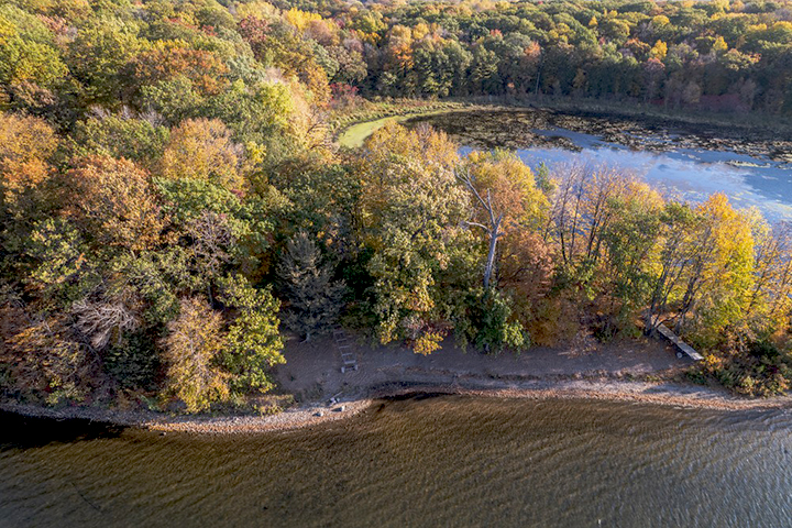 An aerial view of a beach peninsula in the fall.